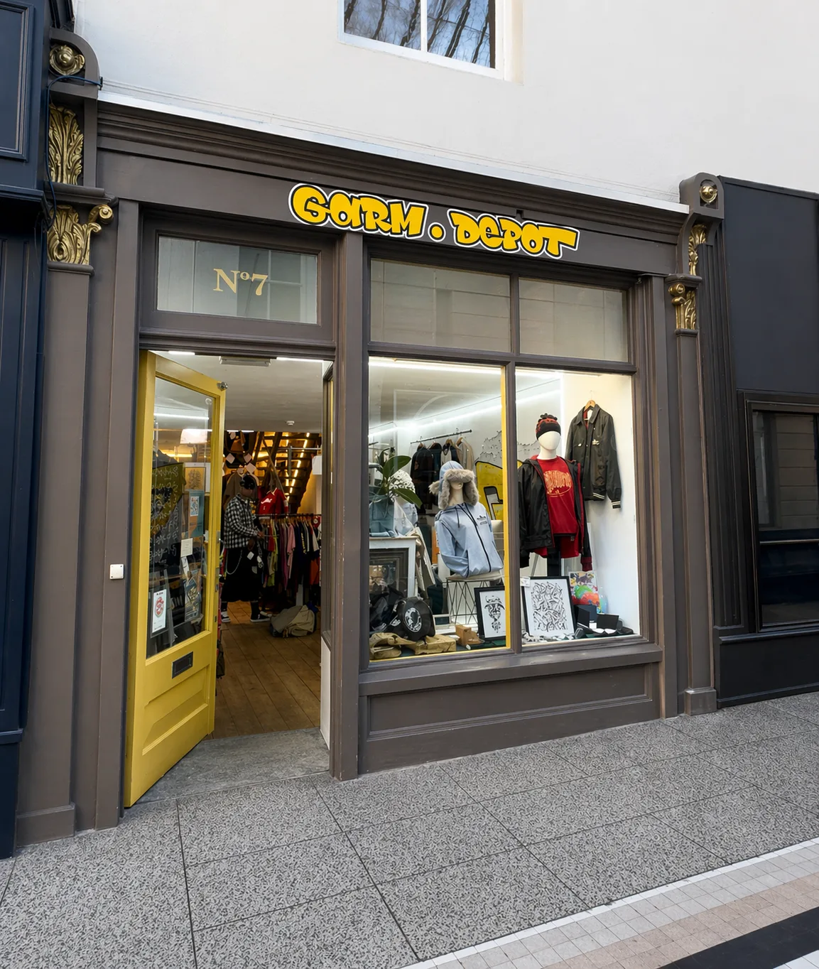 The yellow door of Garm Depot at No.7 The Arcade, Bournemouth
